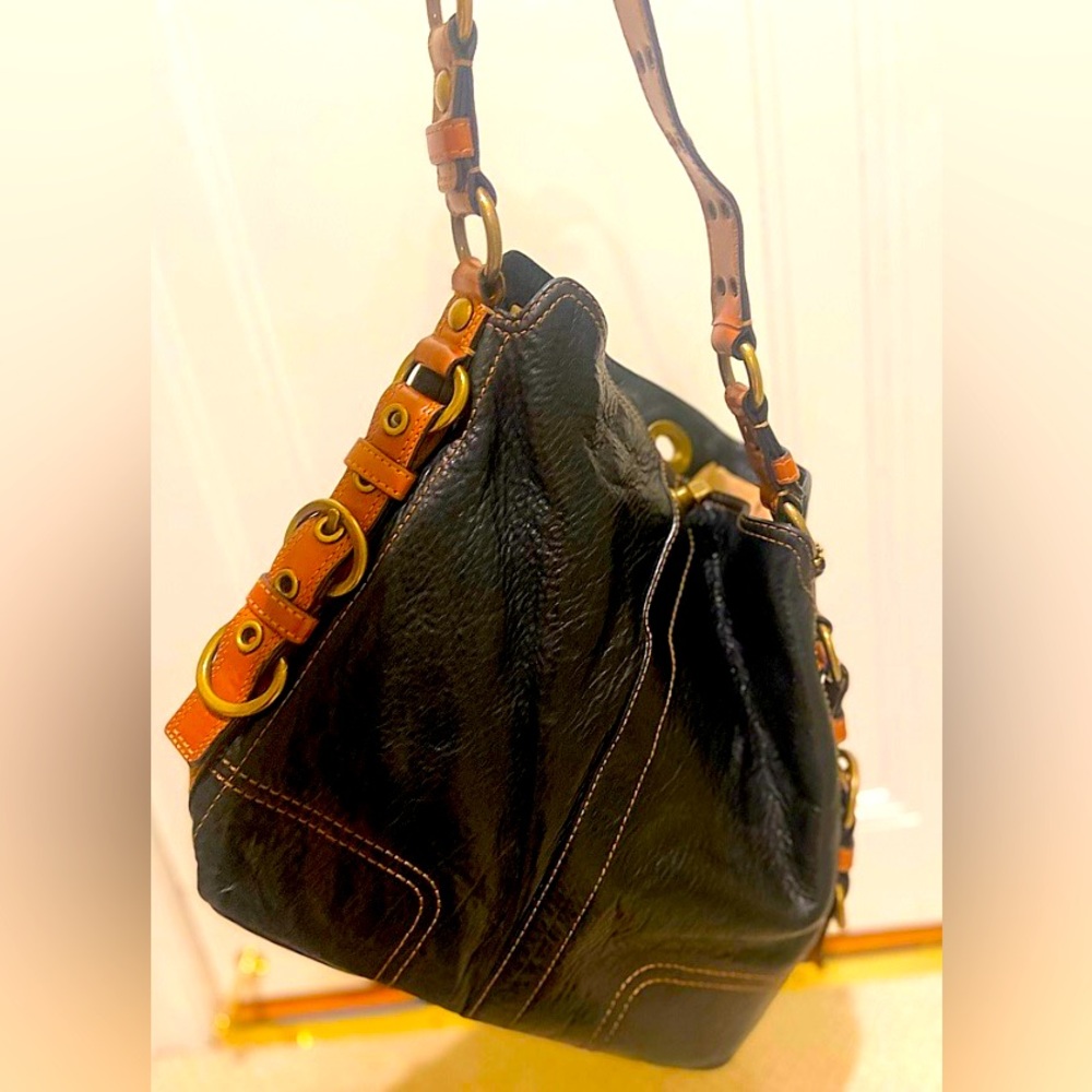 Black pebbled leather coach bucket bag Chelsea style with brown leather accents